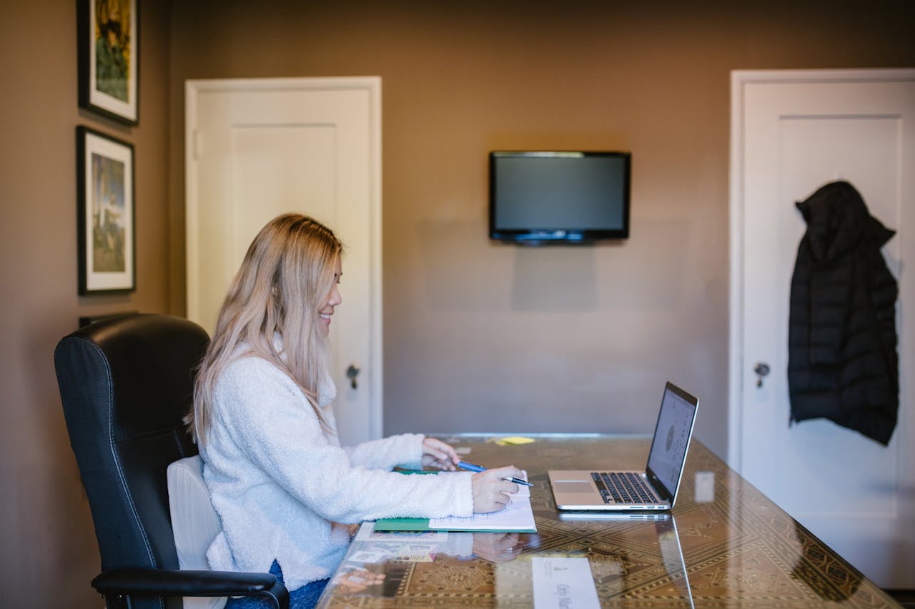 awards-img Woman focused on laptop during remote work from home.